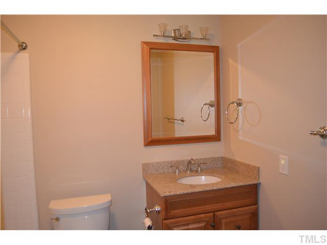 8604 North Roxboro Road Bahama, NC 27503 - Photo 6 of 9 a bathroom with a sink a toilet and mirror