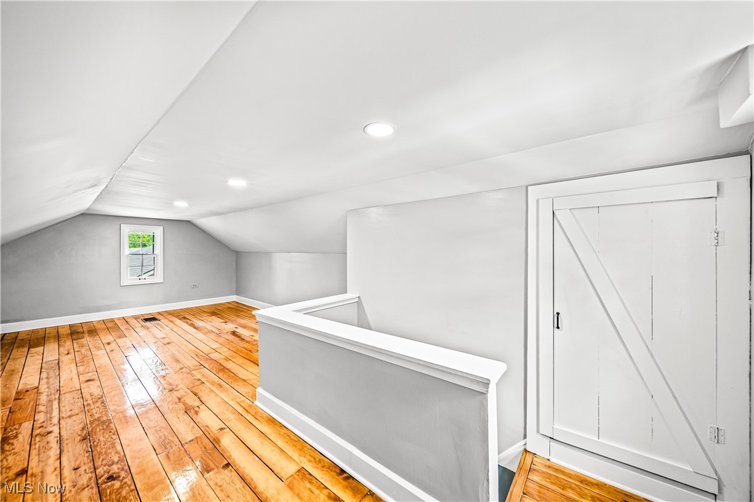 8219 Midland Road Mentor, OH 44060 - Photo 27 of 34 Bonus room featuring vaulted ceiling and light hardwood / wood-style floors