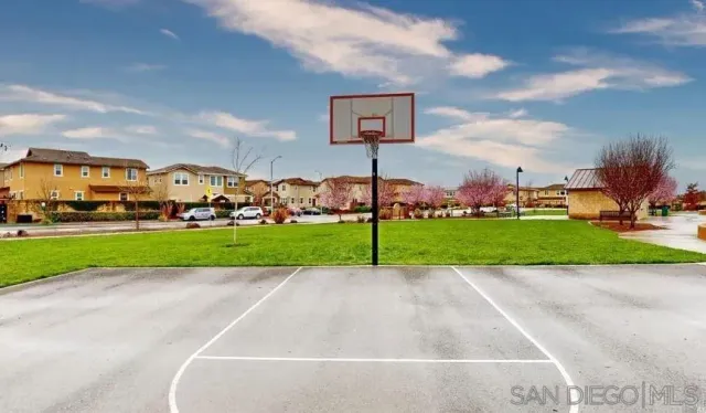 a view of a park with houses