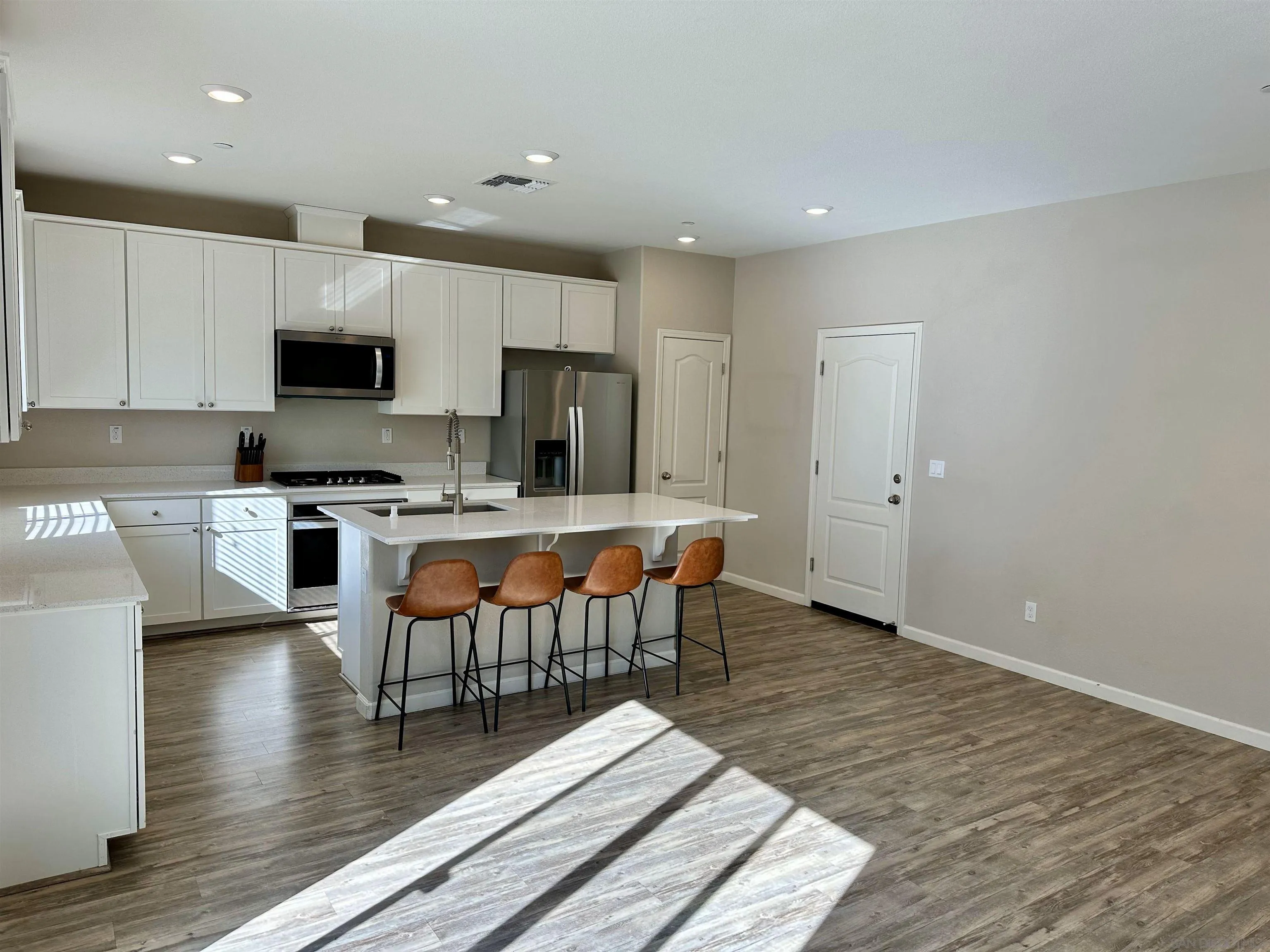 5517 Kennedy Place Rohnert Park, CA 94928 - Photo 2 of 15 a kitchen with stainless steel appliances a refrigerator and a stove top oven