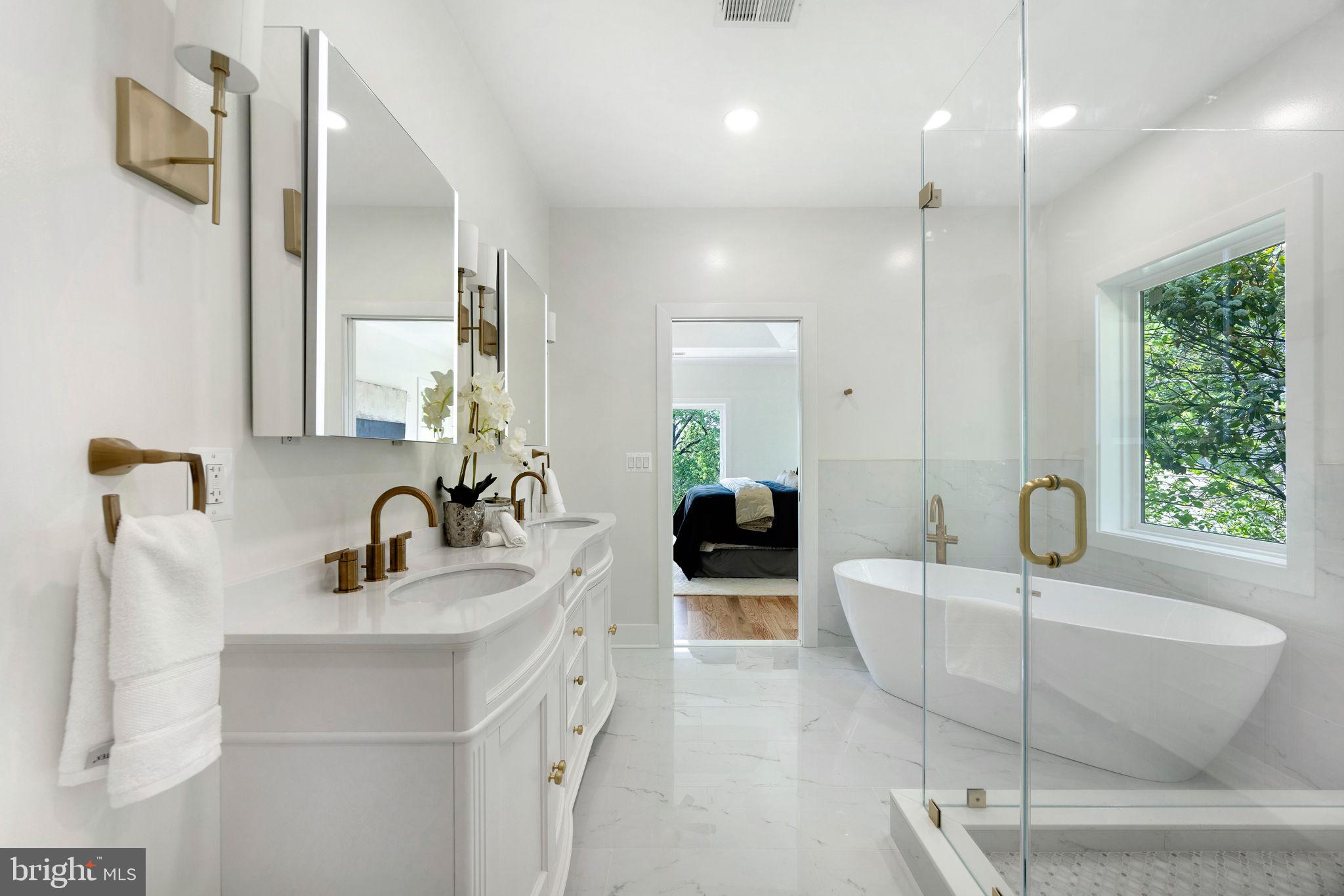 132 North Earley Street Alexandria, VA 22304 - Photo 11 of 45 a bathroom with a double vanity sink tub and mirror