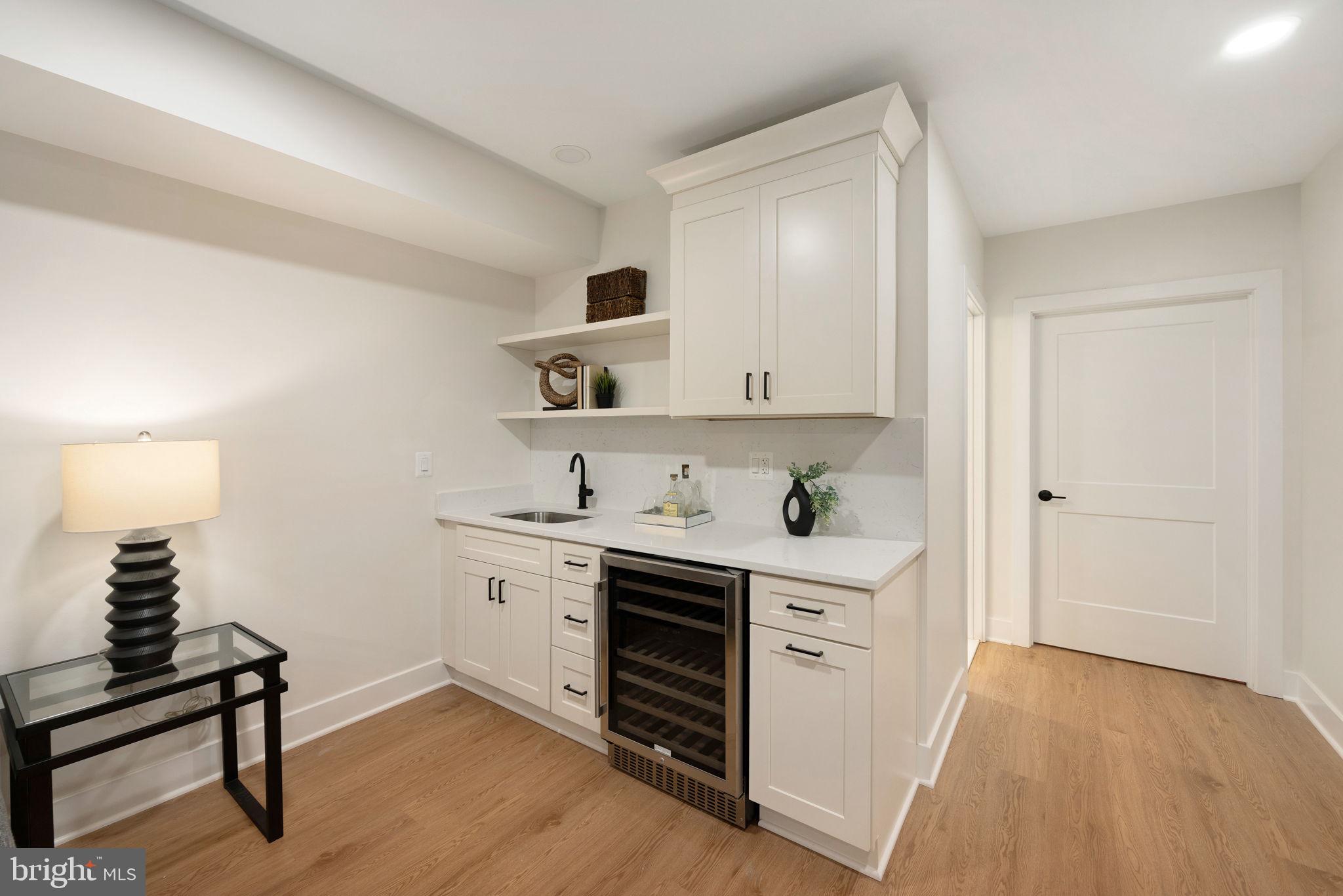 132 North Earley Street Alexandria, VA 22304 - Photo 27 of 45 a view of cabinets a wooden floor and a window in a room