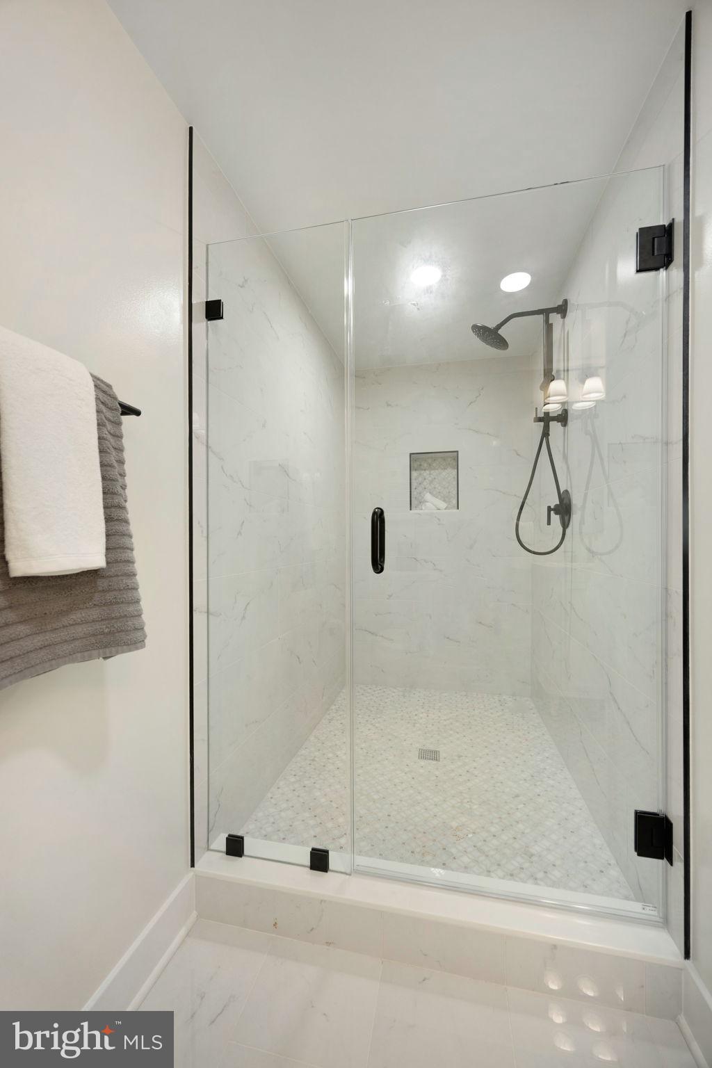 132 North Earley Street Alexandria, VA 22304 - Photo 29 of 45 a bathroom with a glass shower door