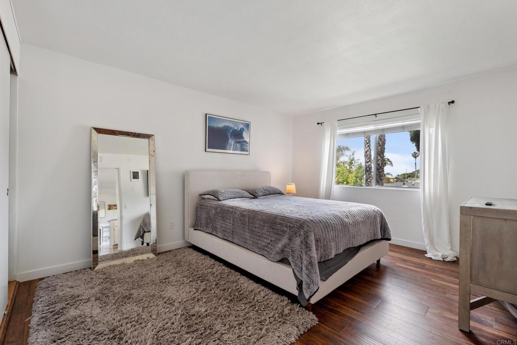 155 Rosebay Drive, Unit 31 Encinitas, CA 92024 - Photo 13 of 31 a bedroom with a bed and a window