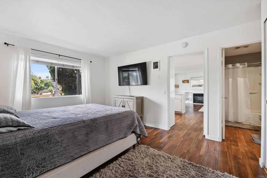 155 Rosebay Drive, Unit 31 Encinitas, CA 92024 - Photo 14 of 31 a bedroom with a bed and a window