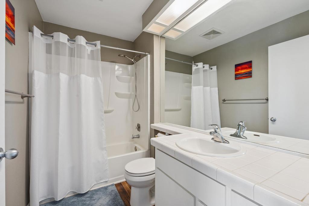 155 Rosebay Drive, Unit 31 Encinitas, CA 92024 - Photo 18 of 31 a bathroom with a sink toilet and shower