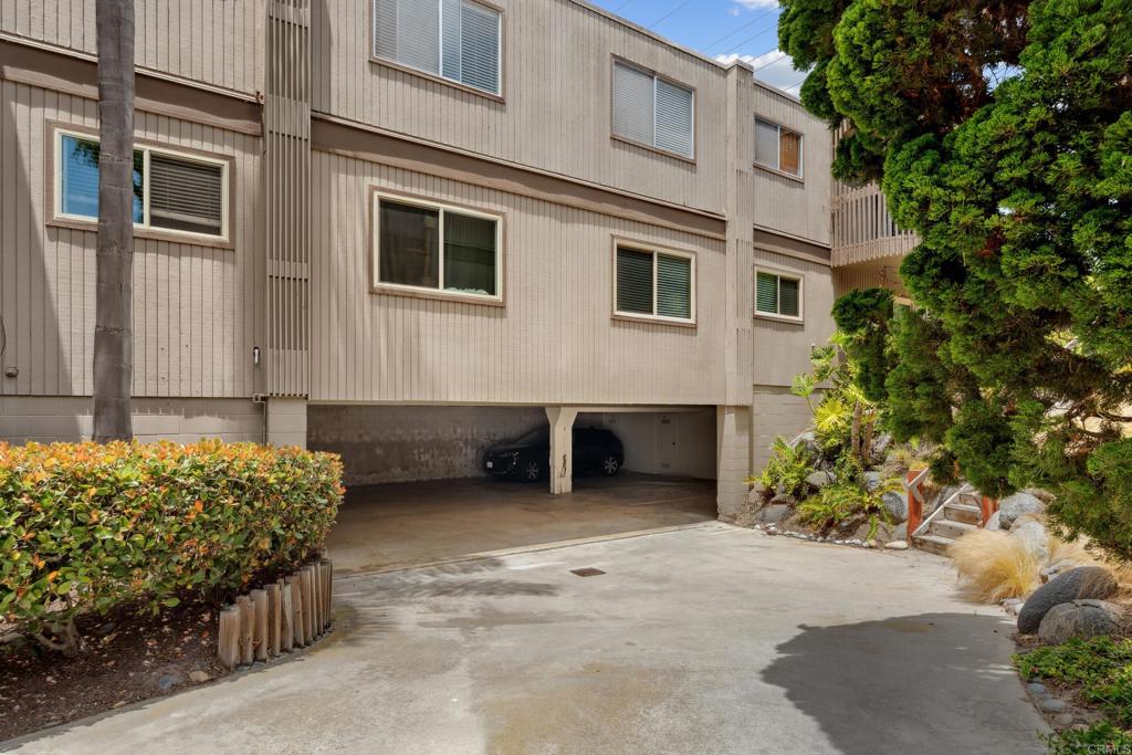 155 Rosebay Drive, Unit 31 Encinitas, CA 92024 - Photo 23 of 31 a view of a house with a yard and garage