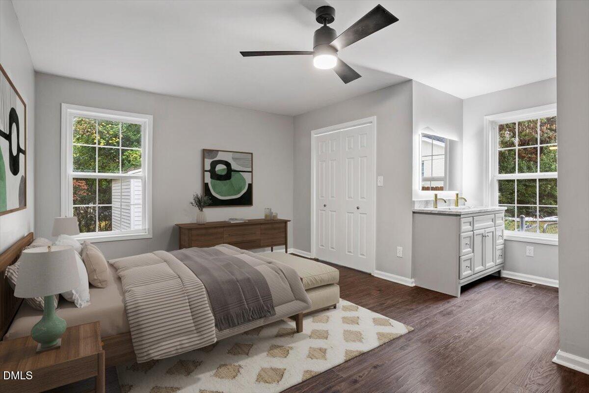 816 Peyton Street Raleigh, NC 27610 - Photo 18 of 29 a bedroom with a large bed and a window