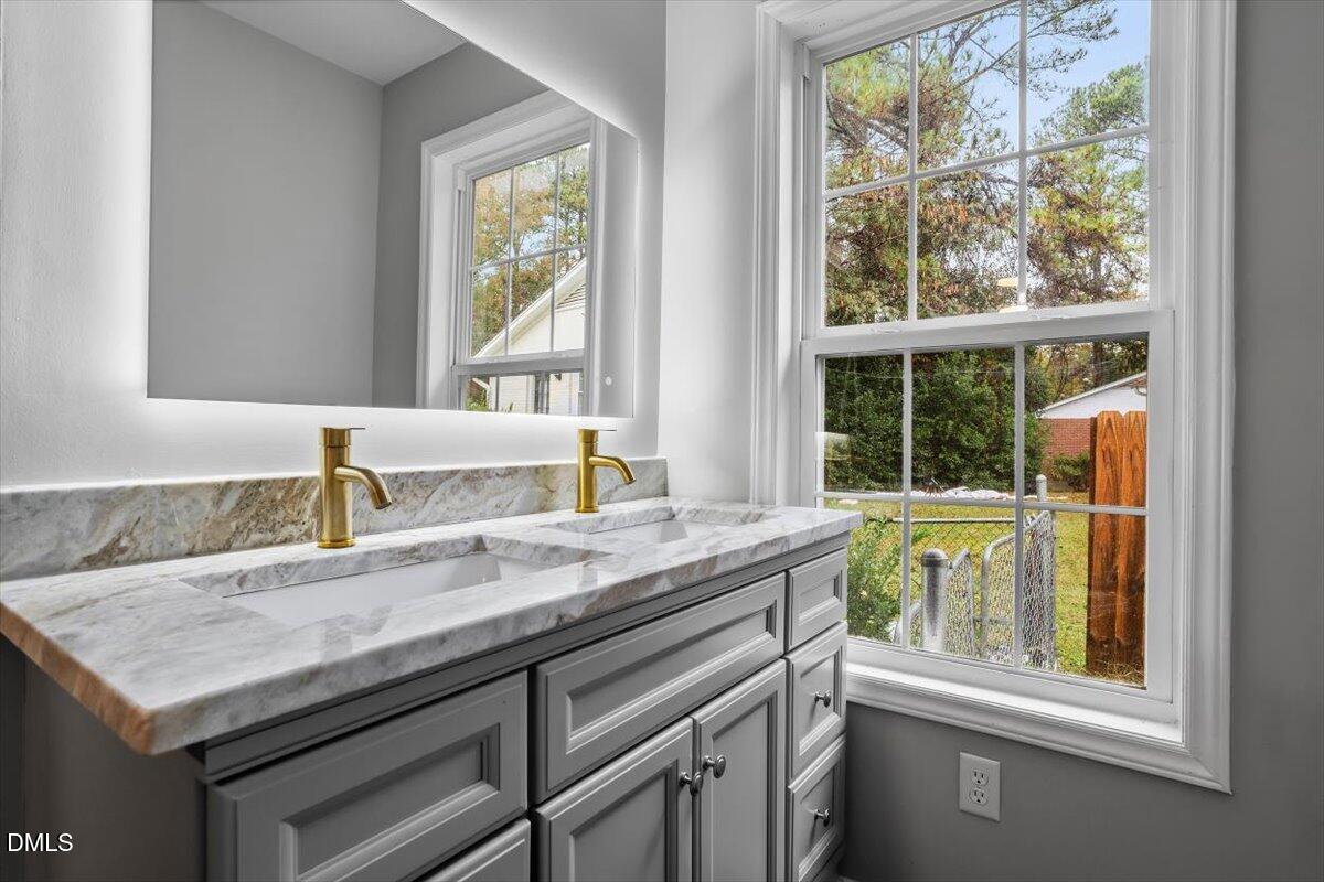 816 Peyton Street Raleigh, NC 27610 - Photo 21 of 29 a kitchen with a sink and a window