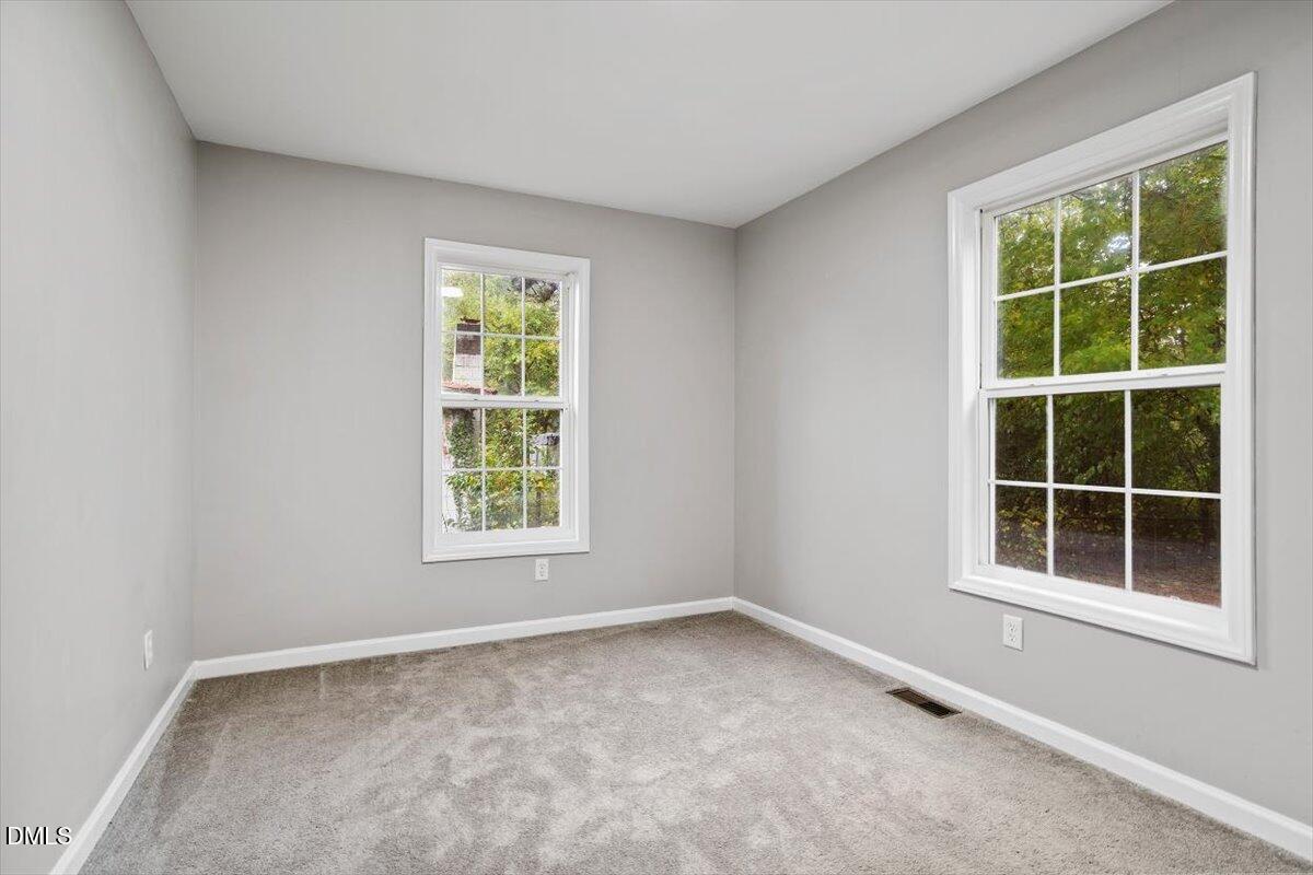 816 Peyton Street Raleigh, NC 27610 - Photo 25 of 29 an empty room with a window