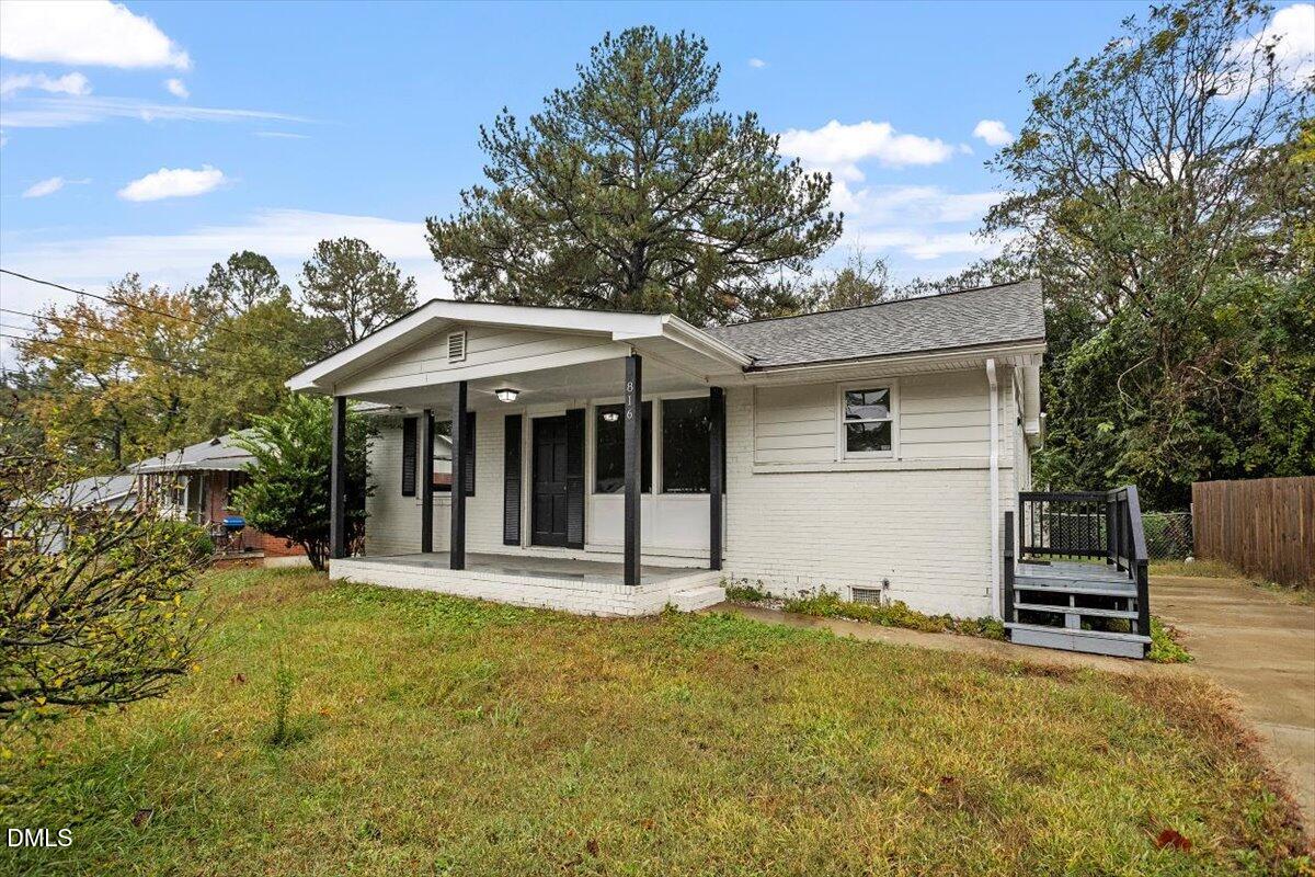 816 Peyton Street Raleigh, NC 27610 - Photo 26 of 29 a front view of a house with a yard