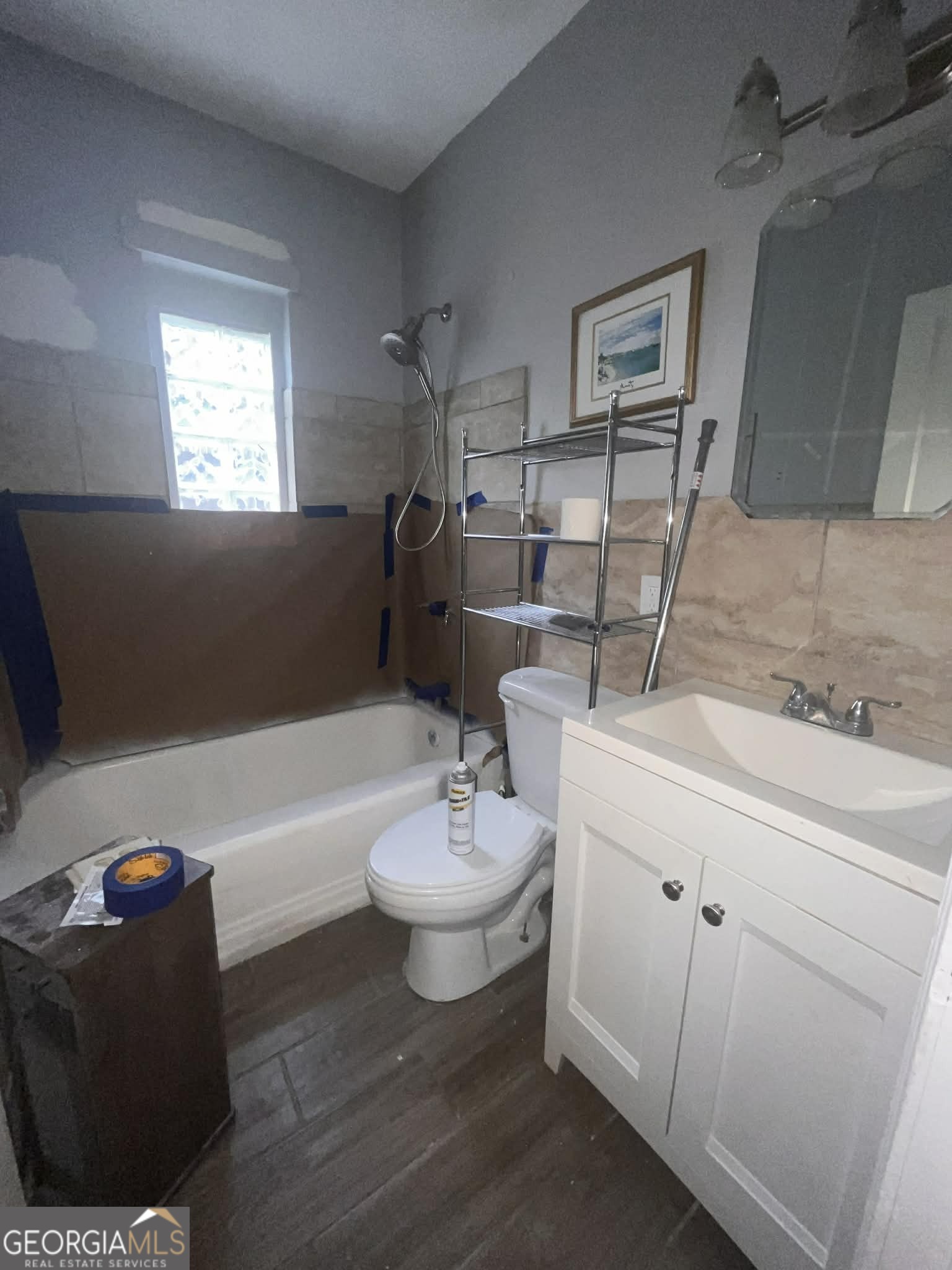 1067 Boulevard Macon, GA 31211 - Photo 6 of 7 a bathroom with a sink and a mirror