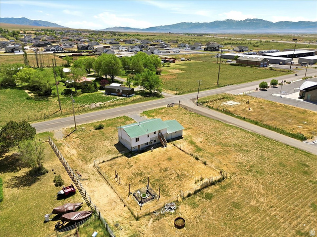 1613 Sunset Road Lake Point, UT 84074 - Photo 33 of 33 Property featuring a two-story structure with a green metal roof and white siding