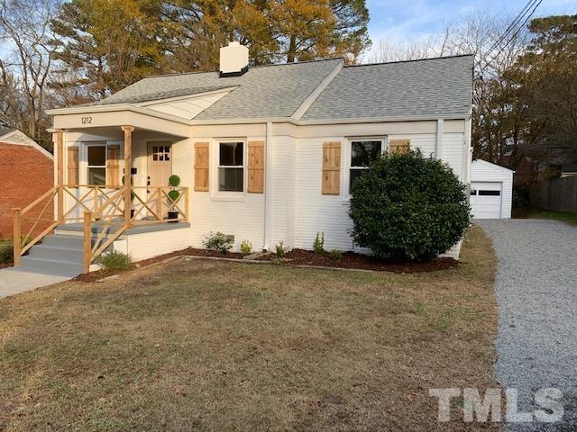 1212 Watauga Street Raleigh, NC 27604 - Photo 3 of 33 front view of a house with a bench
