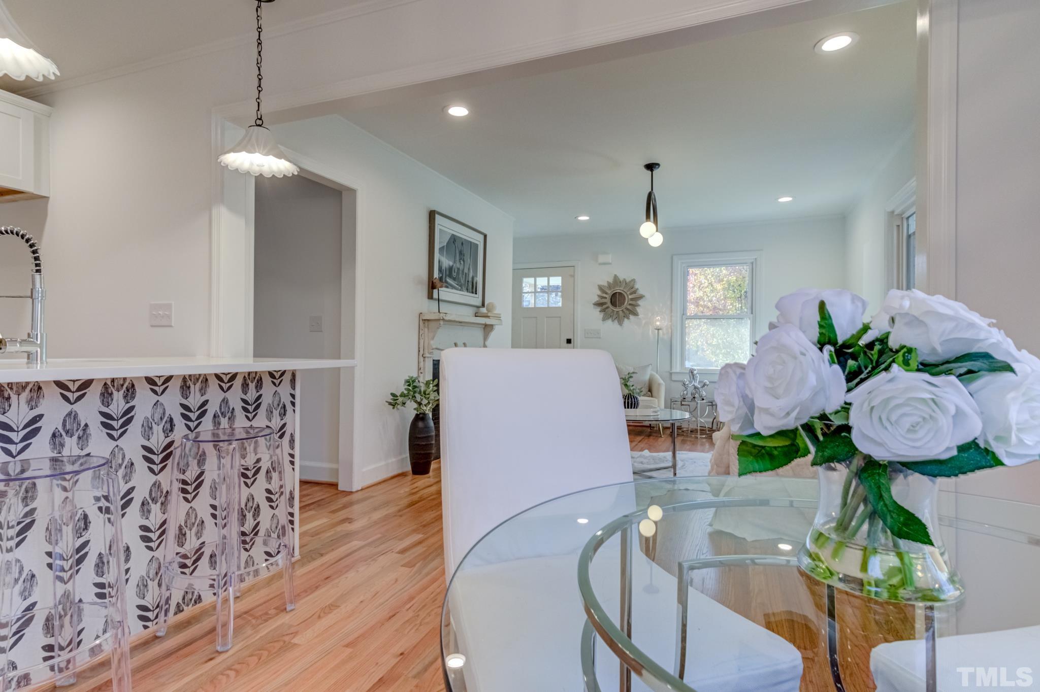 1212 Watauga Street Raleigh, NC 27604 - Photo 22 of 33 a living room with furniture and a chandelier