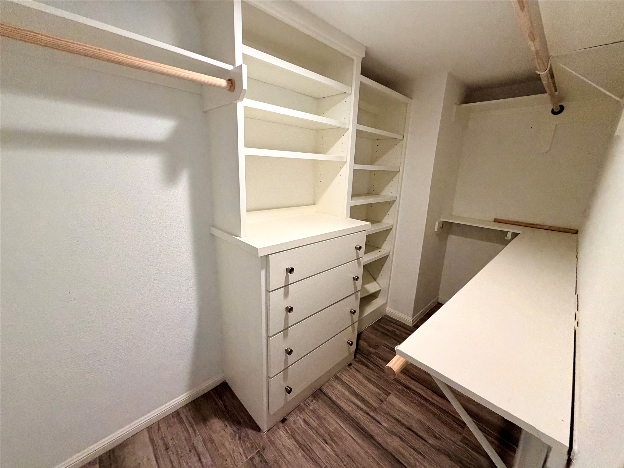 811 Threadneedle Street, Unit 267 Houston, TX 77079 - Photo 15 of 21 a view of walk in closet with empty racks