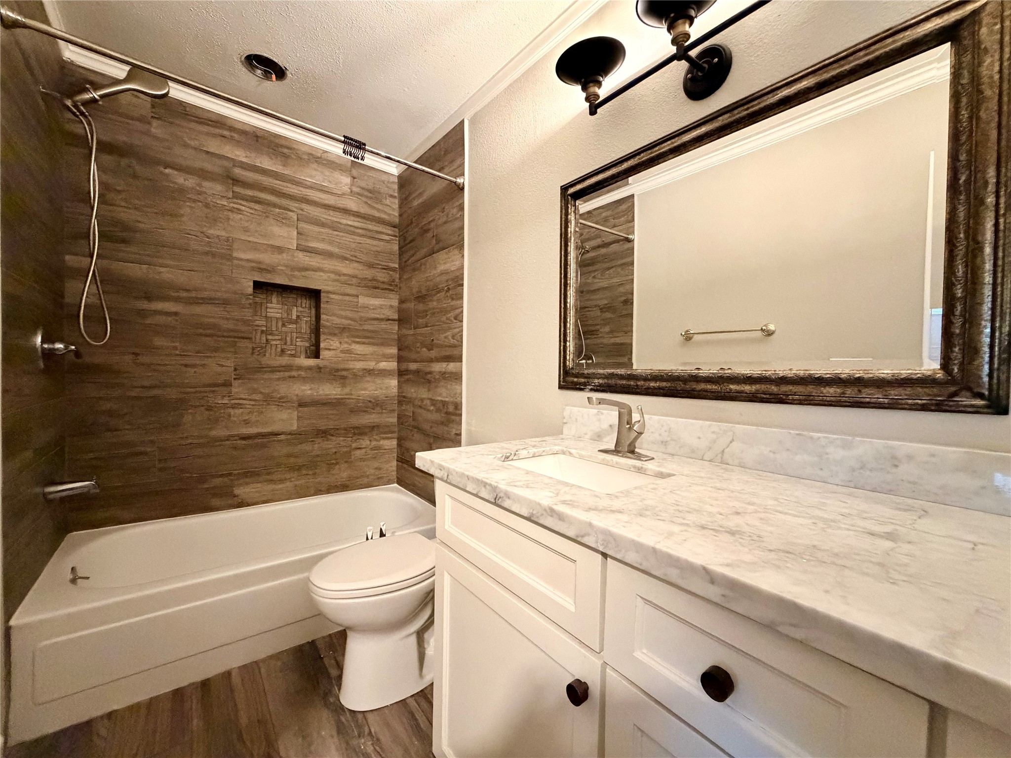 811 Threadneedle Street, Unit 267 Houston, TX 77079 - Photo 17 of 21 a bathroom with a granite countertop sink mirror vanity bathtub and toilet