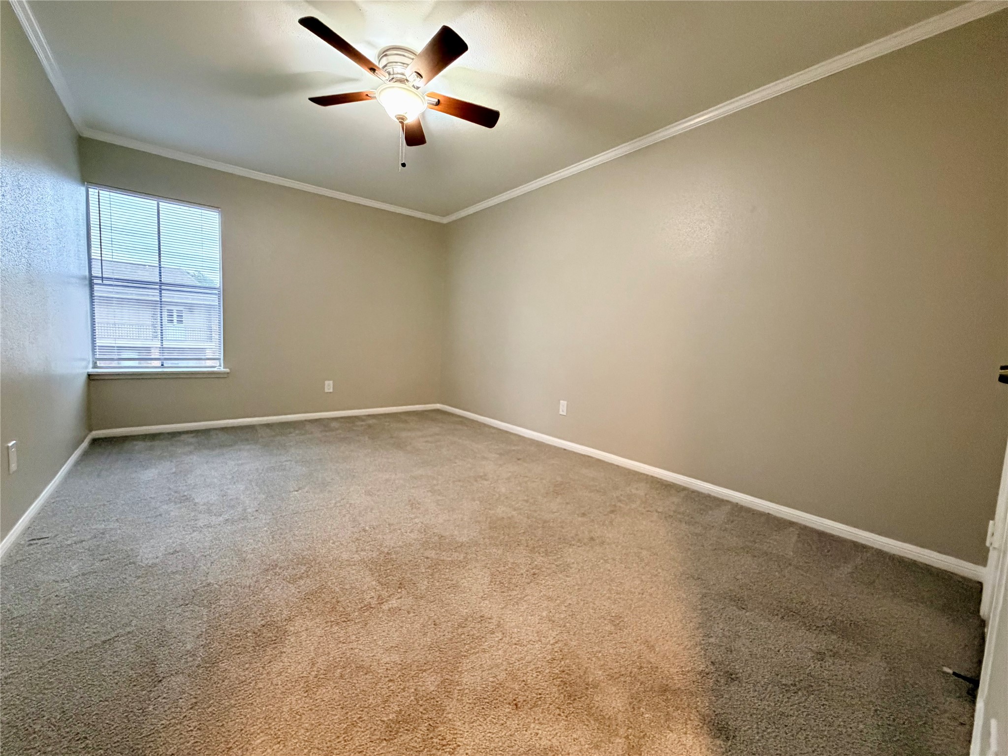 811 Threadneedle Street, Unit 267 Houston, TX 77079 - Photo 18 of 21 an empty room with a window and a fan