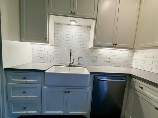a sink with cabinets