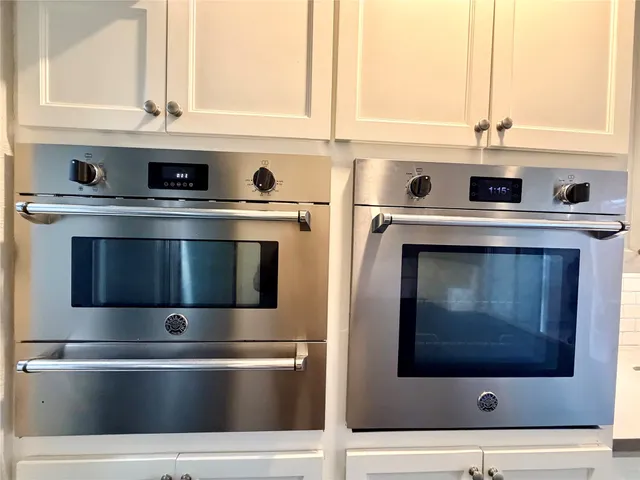 a stove top oven sitting inside of a kitchen