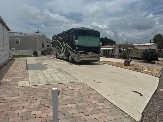 a room with pool table and chairs