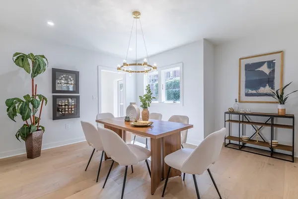 a view of a dining room with furniture window and wooden floor