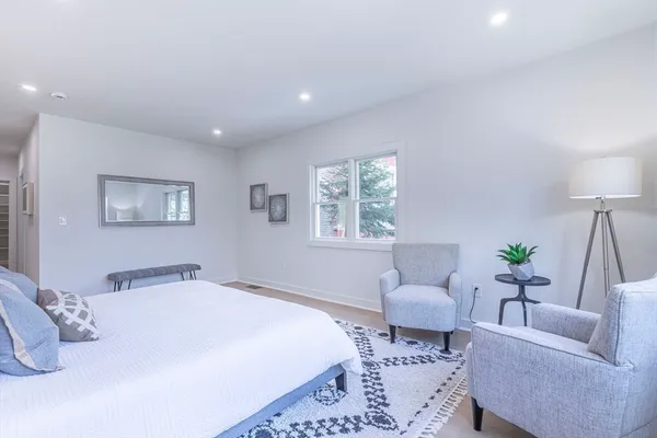 a bedroom with a bed and ceiling couch