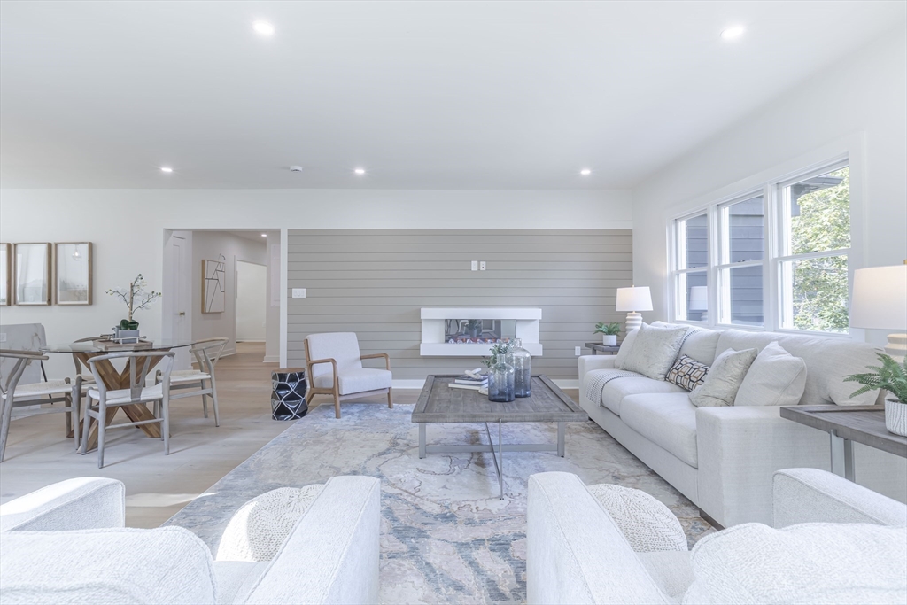 84 Winthrop Road Brookline, MA 02445 - Photo 3 of 42 a living room with furniture and a large window