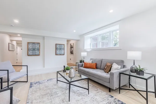 a living room with furniture and a rug