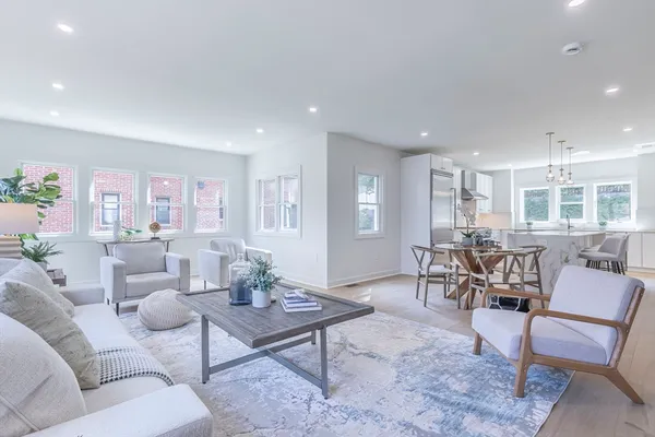 a living room with furniture and a table