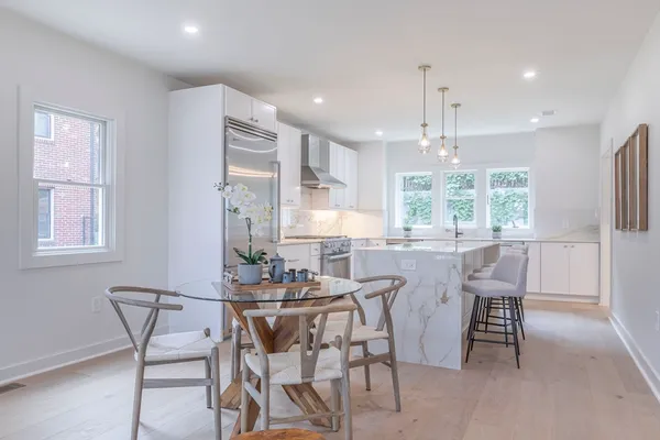 a dining area with furniture and window