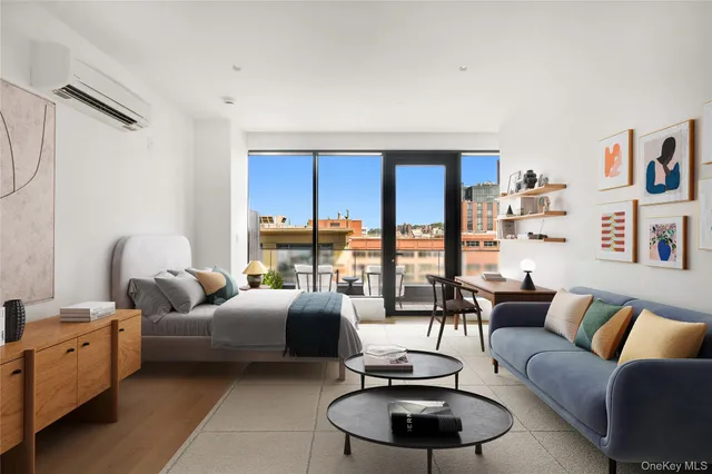 a living room with furniture a rug and a dining table