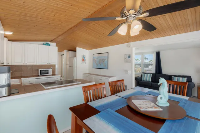 a view of a dining room with furniture and a table