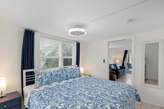 a bedroom with a bed and a television