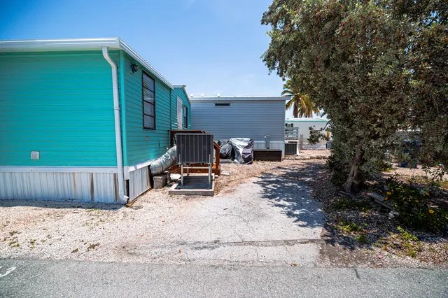 an aerial view of a house with outdoor space