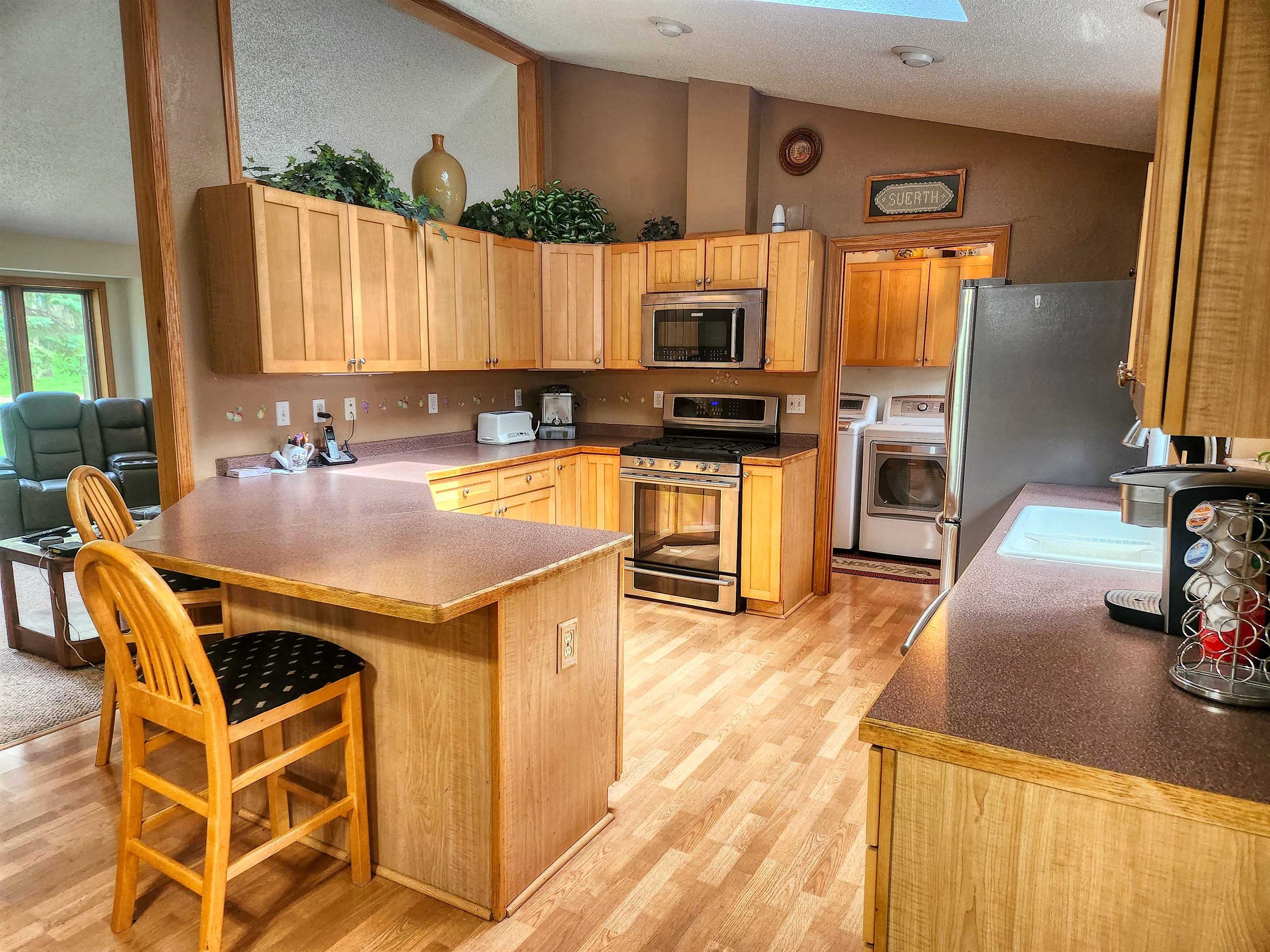 24344 Payne Road Shannon, IL 61078 - Photo 8 of 50 a kitchen with granite countertop a sink appliances and cabinets