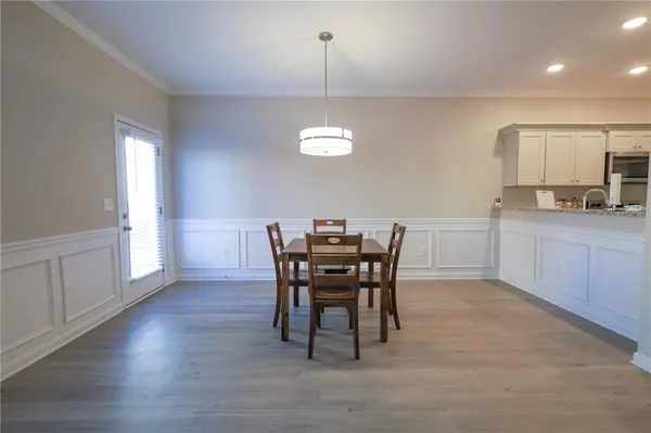 a view of a dining room with furniture and window