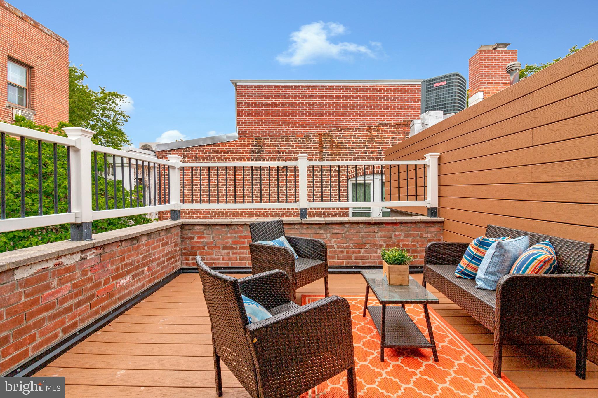 418 Seward Square Southeast, Unit 3 Washington, DC 20003 - Photo 15 of 16 a view of a patio with couches chairs and wooden floor