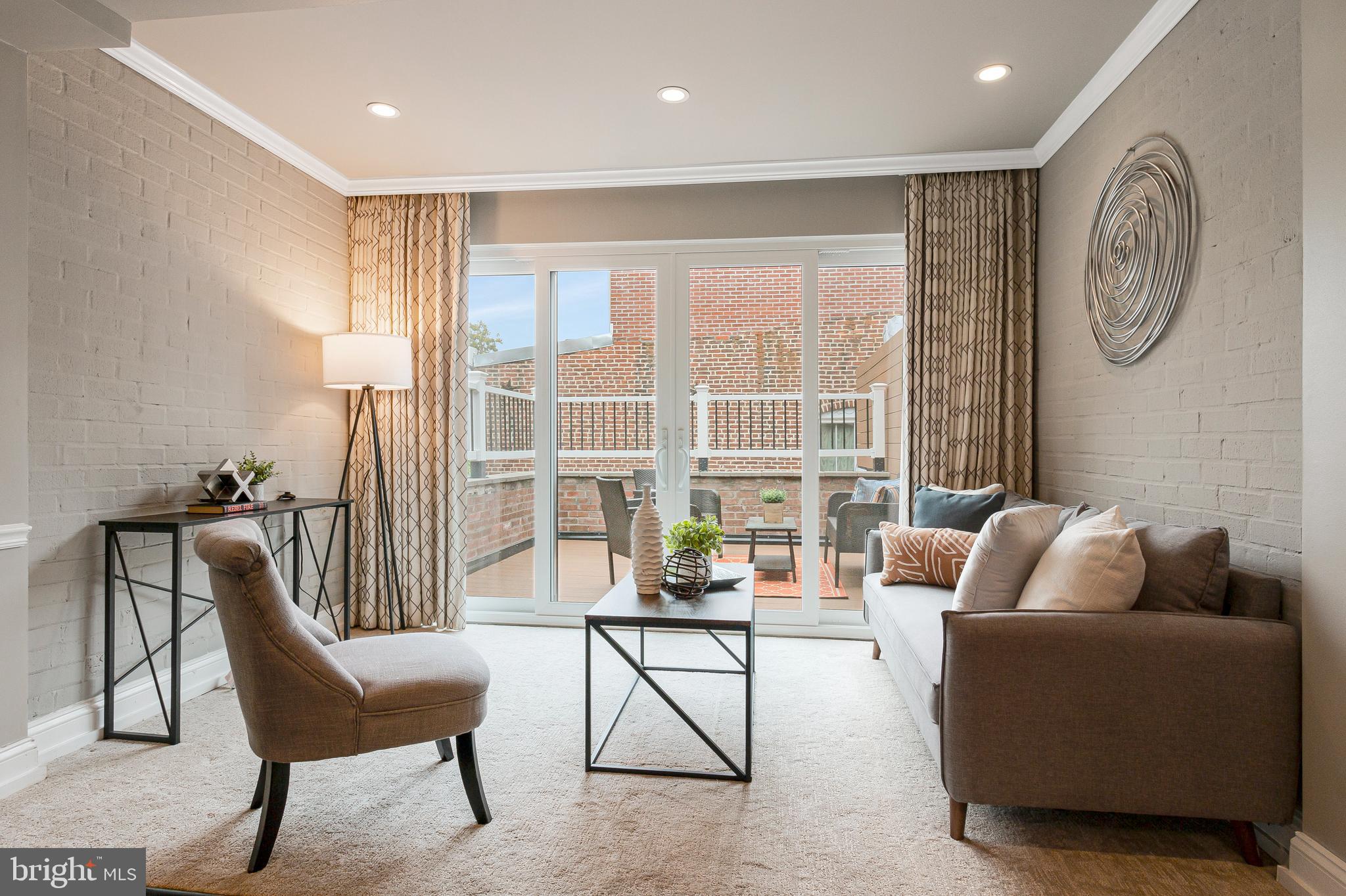 418 Seward Square Southeast, Unit 3 Washington, DC 20003 - Photo 3 of 16 a living room with furniture and a large window