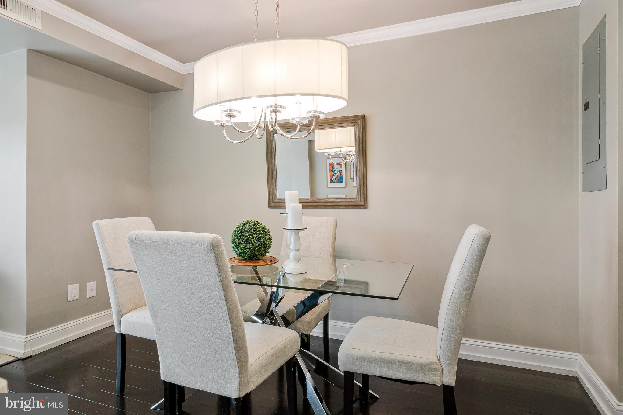 418 Seward Square Southeast, Unit 3 Washington, DC 20003 - Photo 5 of 16 a view of a dining room with furniture and chandelier
