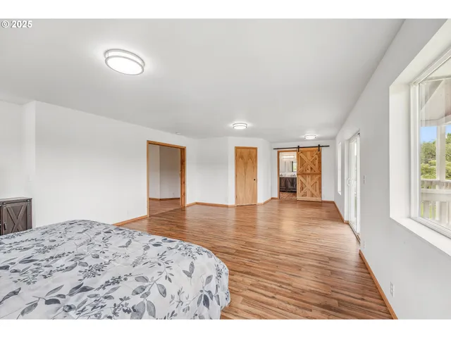 a bathroom with a sink a large mirror and a bathtub