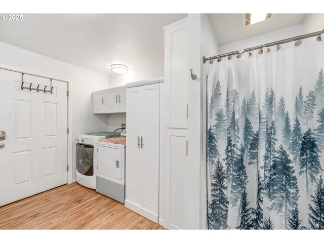 a bathroom with a toilet sink a mirror and vanity
