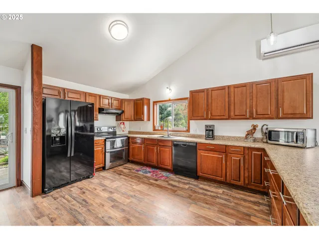 a kitchen with lots of counter top space and appliances