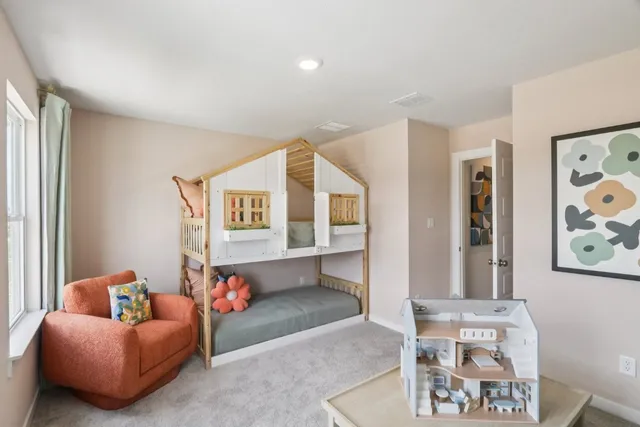 a bedroom with furniture and a window