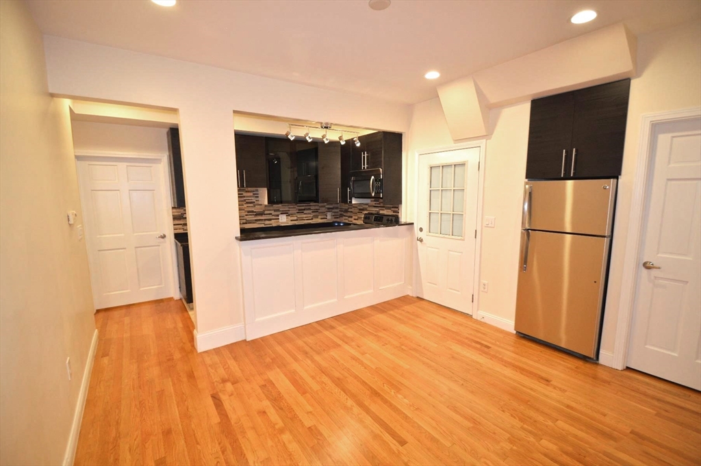 1801 Beacon Street, Unit 4 Brookline, MA 02445 - Photo 8 of 9 a view of a kitchen from the hallway