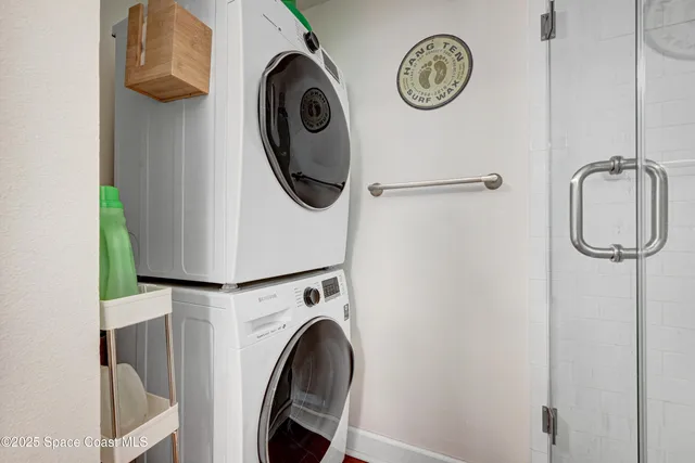a close view of a utility room with dryer and washer