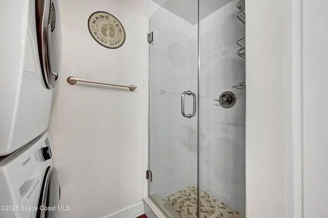 a bathroom with a shower and a sink