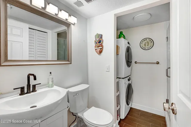 a bathroom with a sink toilet and a shower