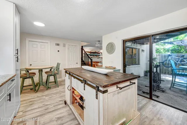 a room with furniture and large windows