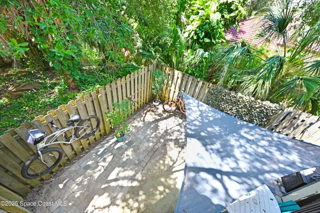 a view of balcony with wooden floor